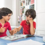 Children practicing phonics skills with a reading book