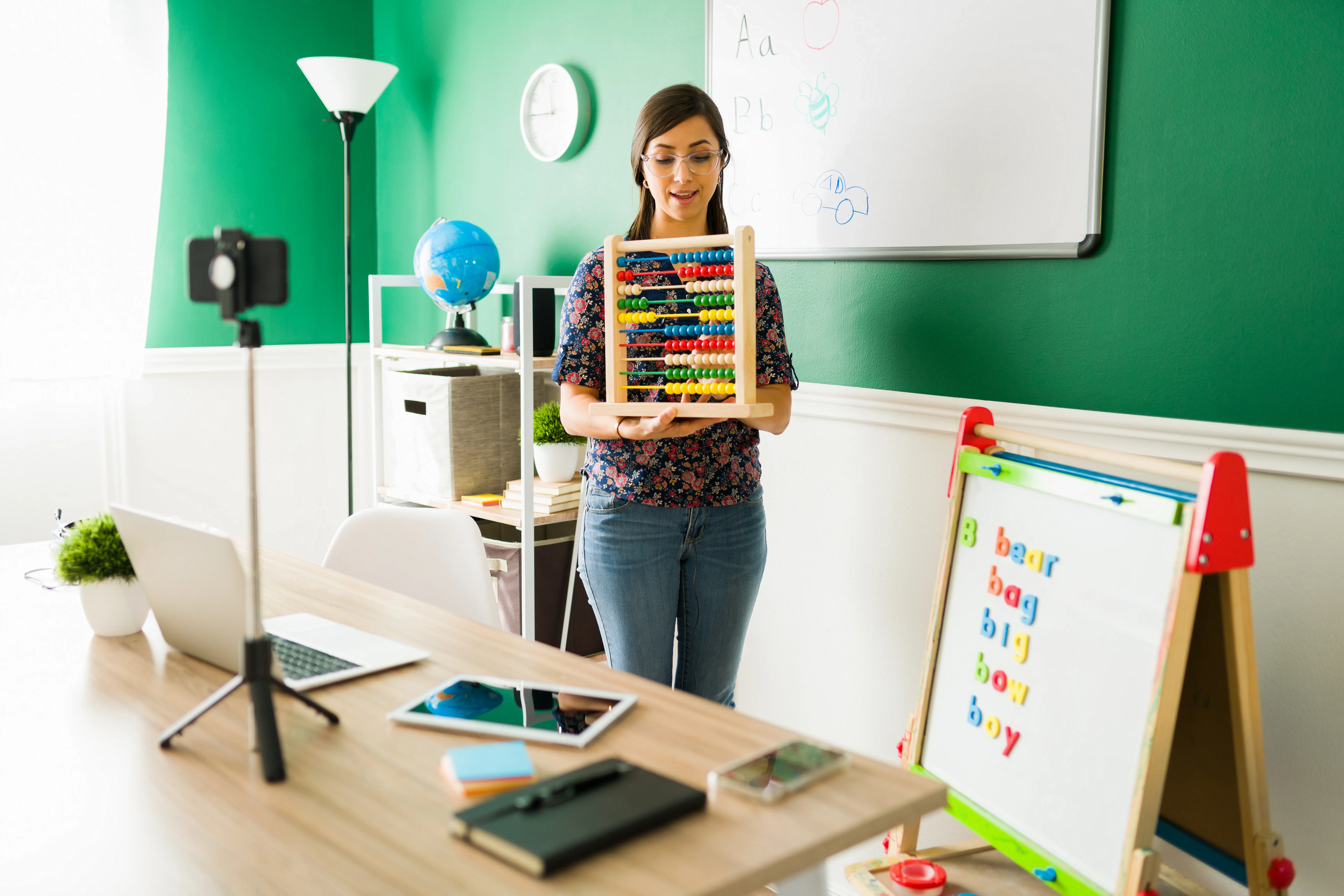 Educator conducting a virtual preschool lesson with learning tools