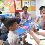 Preschool teacher conducting interactive activity during preschool teacher training session.