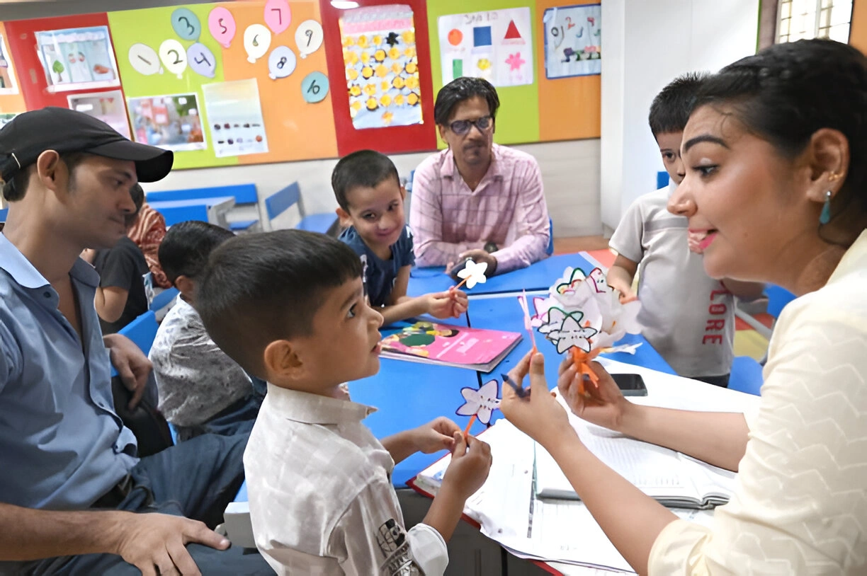 Preschool teacher conducting interactive activity during preschool teacher training session.