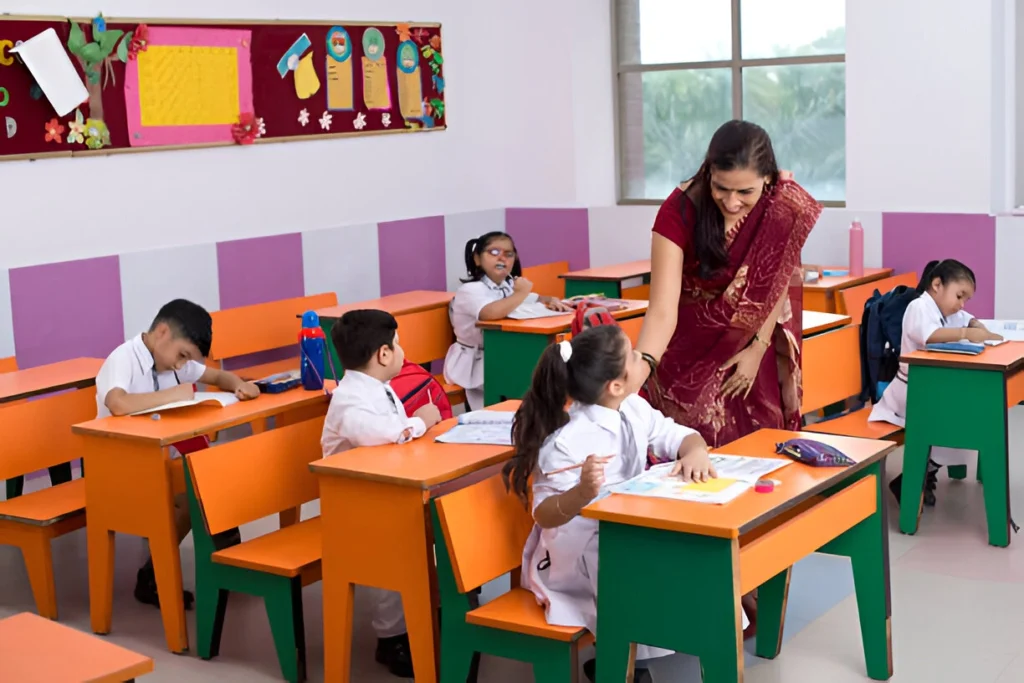 Preschool teacher guiding young students during classroom activity.