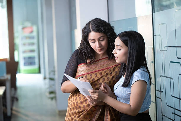 Students discussing coursework during an online counselling course in India session.