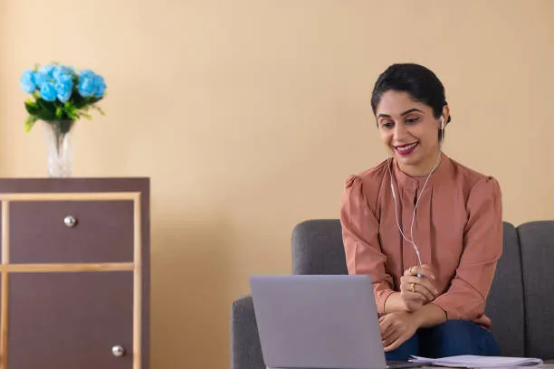 Student attending Online Counselling Courses on a laptop from home