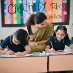 Special education classroom activity with teacher guiding children during drawing task