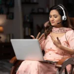 Woman attending online counselling course in India via laptop session.