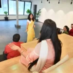 Students participating in an interactive classroom session during one of the best teaching courses, led by a trainer in a modern learning environment.