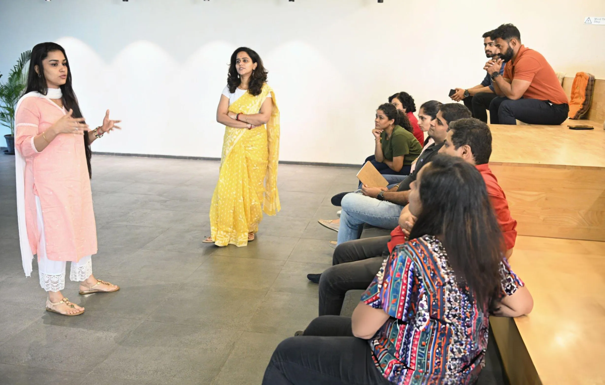 Instructor conducting a Phonics Teacher Training Course with aspiring educators in an interactive classroom session