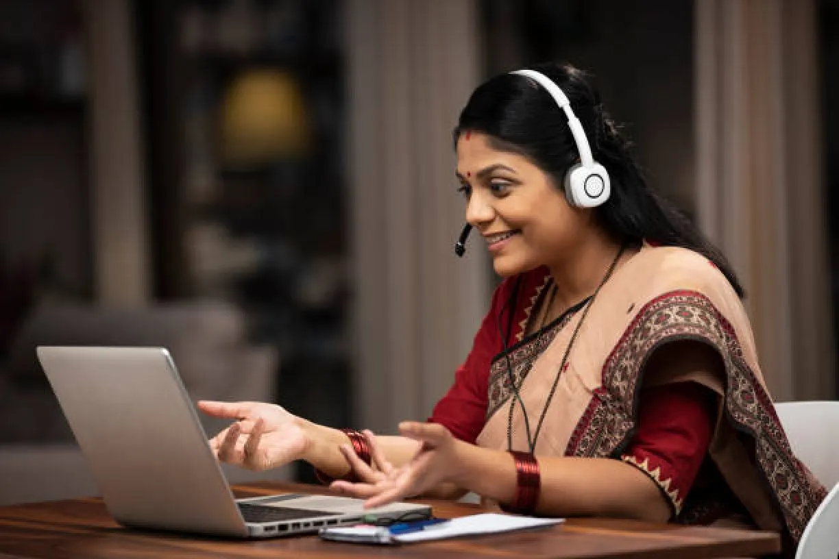 A woman taking a online course of teacher training from National Academy