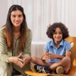 Child psychologist guiding a young boy