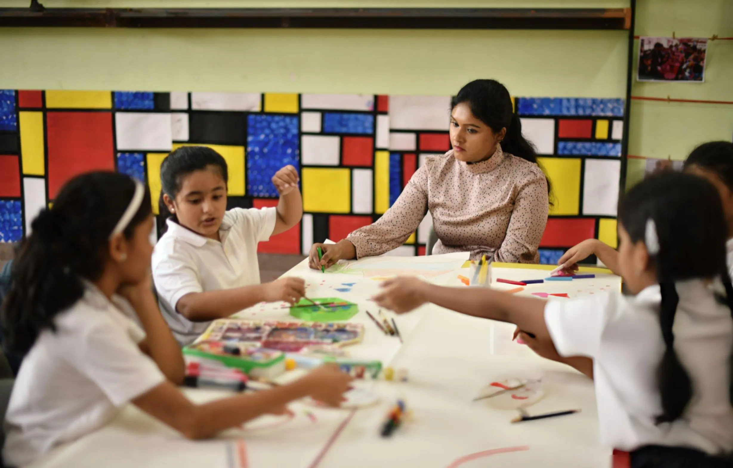 teacher in a phonics training set up