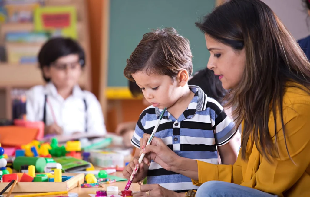 Teacher Teaching a student in a Day Care