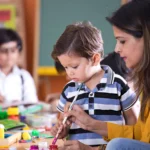 Teacher Teaching a student in a Day Care