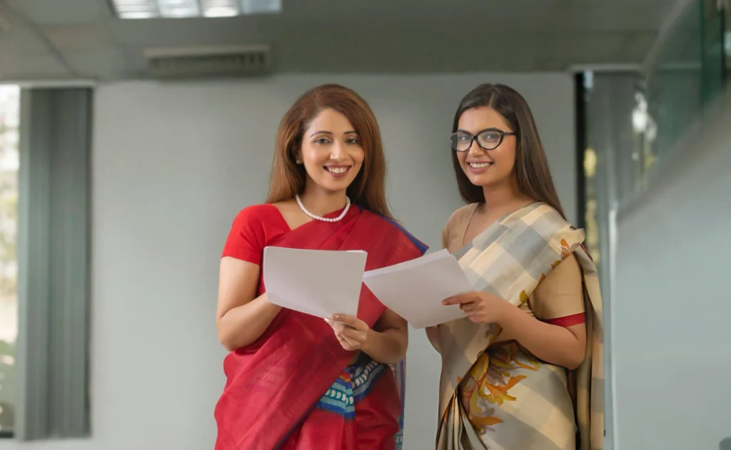 Teachers holding documents during teacher training course