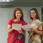 Teachers holding documents during teacher training course